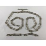 A late 20th Century silver double watch chain / necklace with spare links