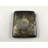 A George V silver cigarette case, with foliate-engraved decoration and monogram, 81g