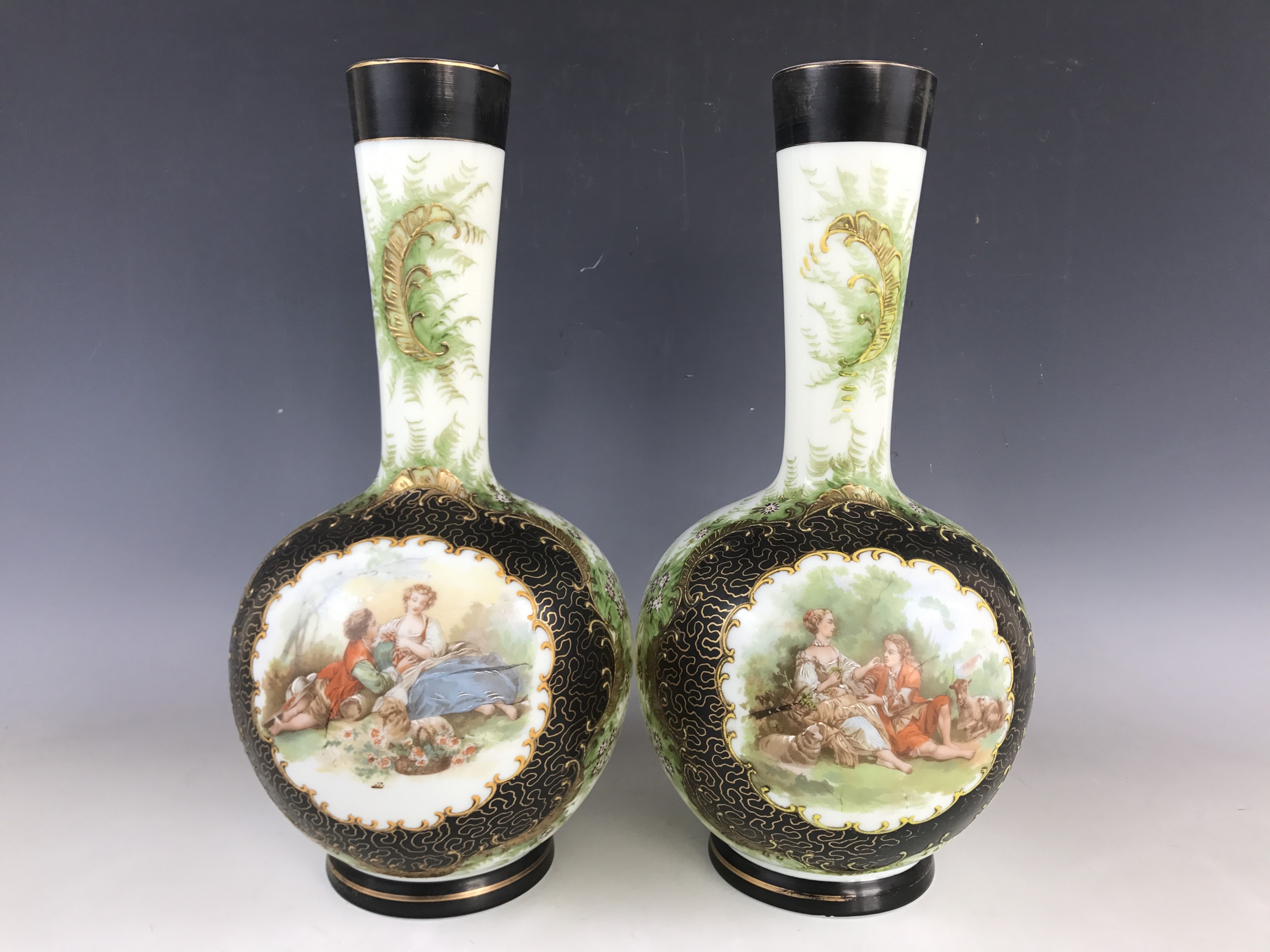 A pair of late Victorian enamelled glass vases