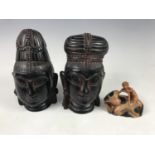 A small Chinese carved soapstone figure and a pair of South Asian resin busts