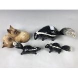 Three Beswick skunk figurines together with a Beswick Cats 1296 figurine