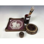 A quill box together with a small tray and butter stamp etc