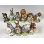 A quantity of Beswick and Royal Doulton Beatrix Potter and other figurines