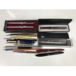 Fountain pens manufactured by Marksman and Sheaffer, together with a Papermate pen and propelling-