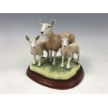 A boxed Border Fine Arts boxed figurine, Sheep Breeds Series, Blue Faced Leicester Ewe and Lambs,