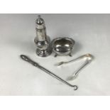 A silver baluster-form pepperette, together with sugar tongs etc