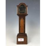 A Victorian marquetry inlaid pocket watch stand modelled as a long case clock