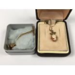 A 9ct gold and shell cameo pendant necklace, having a trefoil suspender, 1.8g together with a 9ct