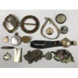 A quantity of vintage costume jewellery including silver chains and a necklace, lockets, fobs, a "