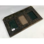 An Edwardian Arts and Crafts Gothic style chip-carved photograph frame