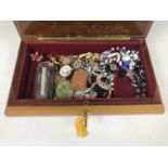 A vintage Sorento Ware jewellery box containing a quantity of vintage costume jewellery including
