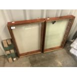 A pair of wall mounted display cabinets