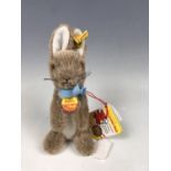 A Steiff Manni miniature rabbit, in brown, with original paper tags