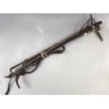 A 1912 silver-collared antler-handled riding crop / whip by Schomberg of London, together with a
