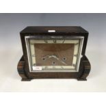 An oak cased mantel clock