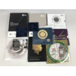 A quantity of Queen Elizabeth II Royal Mint numismatic year sets and commemorative coins,