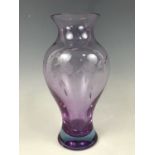 A boxed Caithness Glass Wildrose Chinese vase, in ruby, having wheel-cut decoration, 25 cm
