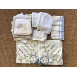 A large quantity of vintage hand-embroidered table linens