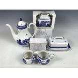 A quantity of boxed Ringtons Willow pattern wares including a coffee pot, tea pots and a breakfast