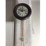 An early 20th Century German 'postman's clock' retailed by Thomas Lovejoy of Wimbledon, having a