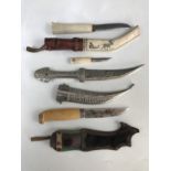 A Swedish hunting knife by Morakniv, a Finish bone-handled hunting knife and one other Middle