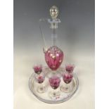 A floral enamelled glass liqueur / decanter set