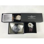 Three contemporary wrist watches in packaging, respectively Winner, Shenhua and Breytenbach