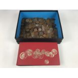 A large quantity of GB copper coins, QVC to QEII, together with an album of GB brass 3d and post