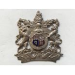 An early 20th Century enamelled white-metal Royal Arms badge / plate, 9 cm x 8 cm