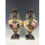 A pair of late 19th / early 20th Century flamboyant earthenware vases, (one a/f)