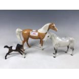 A Beswick Palomino figurine together with two other Beswick pony figures