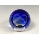A Caithness glass paperweight, bubble included and wheel-cut in depiction of dolphins