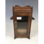 A late 19th Century oak smokers' cabinet, 32 cm high