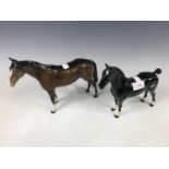 A Beswick Black Magic horse figurine together with one other