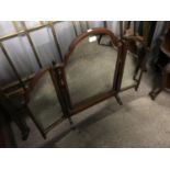 An early 20th Century mahogany framed triptych swivel dressing table mirror