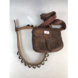 A vintage hide shotgun cartridge bag and cartridge belt