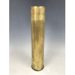 A brass shell case, 39 cm