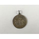 A Victorian Highland and Agricultural Society of Scotland white-metal prize fob medallion awarded in