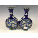 A pair of Chinese cloisonné enamelled vases, of flask form, decorated with prunus blossom, 24 cm