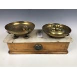 A vintage set of counter-top beam scales with Avery weights etc