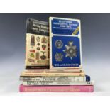 A quantity of books on medals and badges
