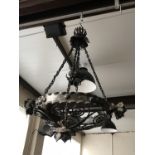 A wrought-iron pendant ceiling light / corona
