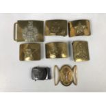A number of British, Soviet and other military brass buckles