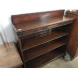 A George V mahogany open-fronted bookcase with adjustable shelves