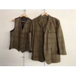A gentleman's tweed ensemble, comprising Islay Woollen Mill tweed shooting jacket and matching