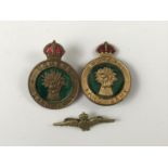 Two Second World War Women's Land Army cap badges, together with an RAF sweetheart badge