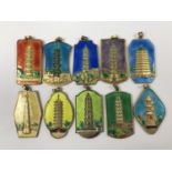 A set of ten Chinese basse-taille enamelled pendants depicting pagodas, each approximately 4 cm