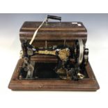 An early 20th Century Jones Family CS sewing machine with case