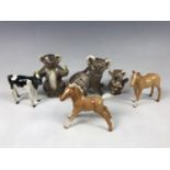 Three Beswick koala figurines together with two Beswick foals and a Beswick calf