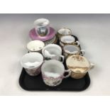 A collection of nine porcelain moustache cups